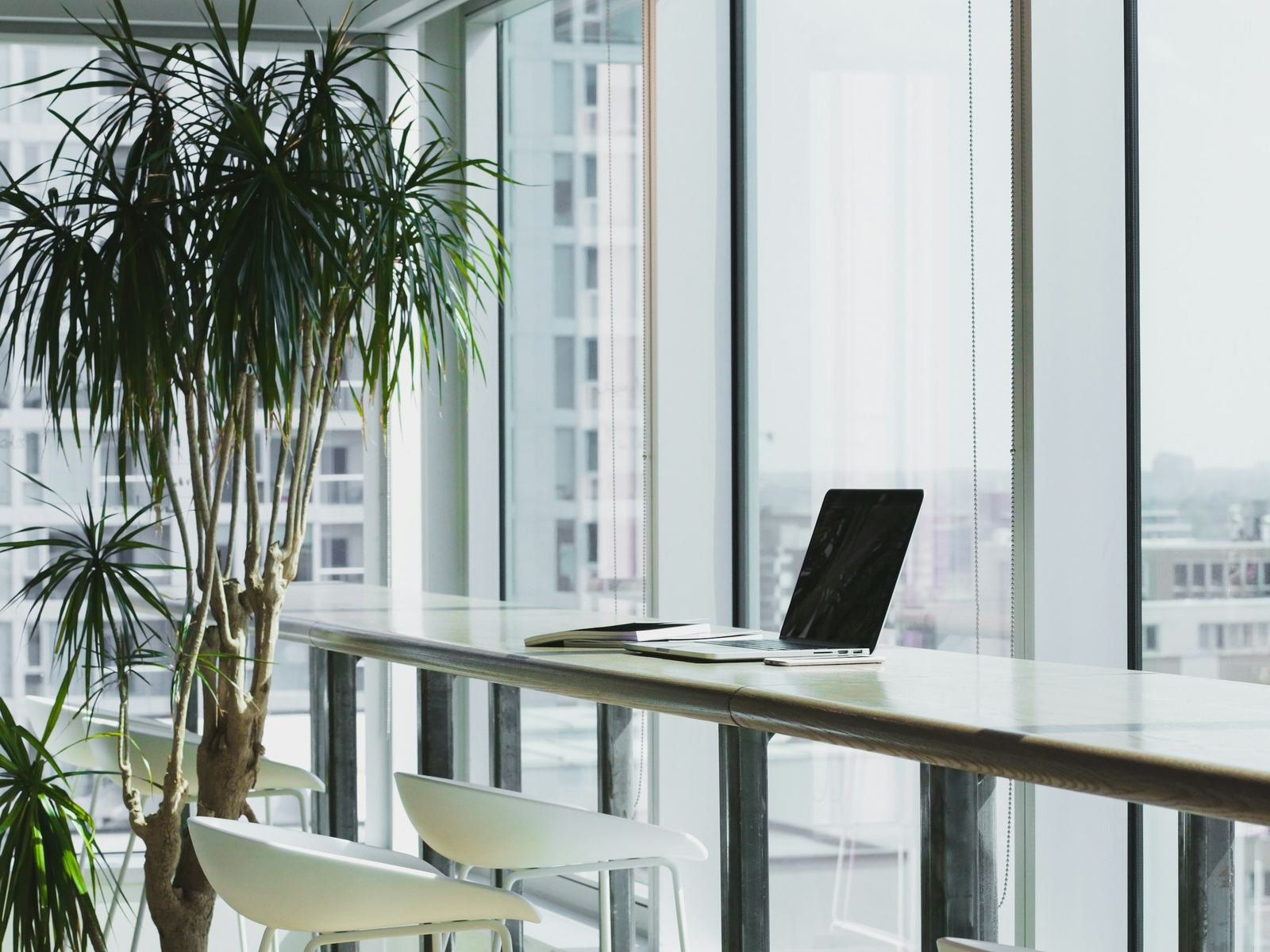 Workspace with laptop by the window